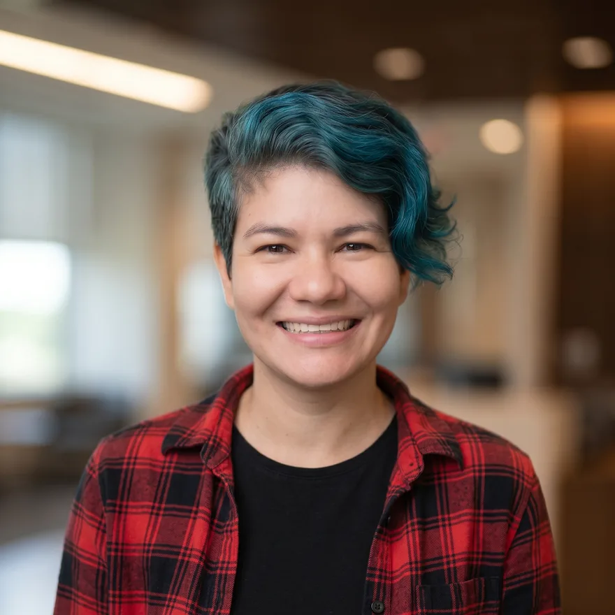 Portrait of Lisbey Urrea Marin, smiling in an office setting
